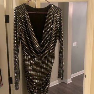 Metal gun and black sparkly black dress